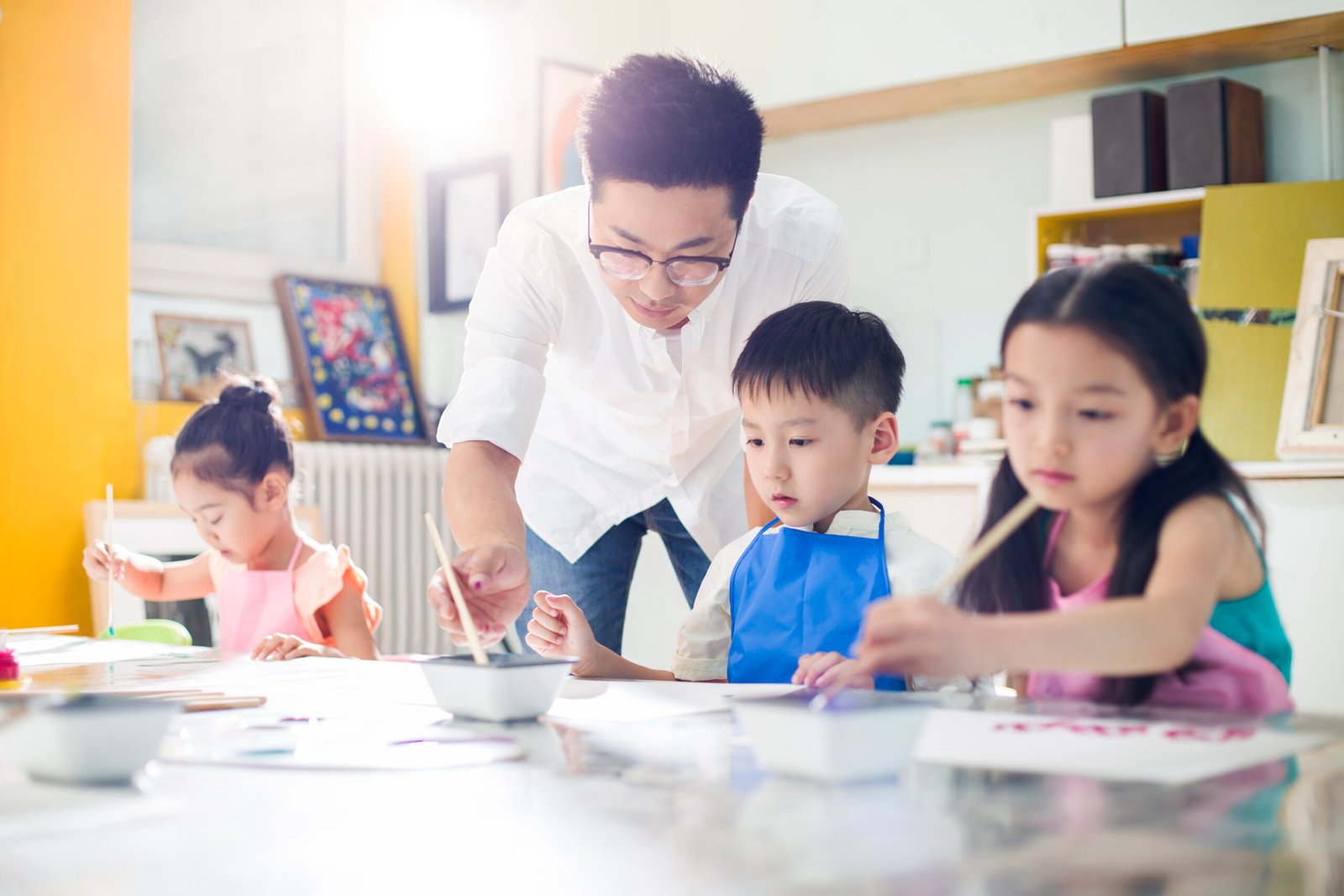 little children painting in art class with teacher 2023 11 27 05 04 17 utc scaled